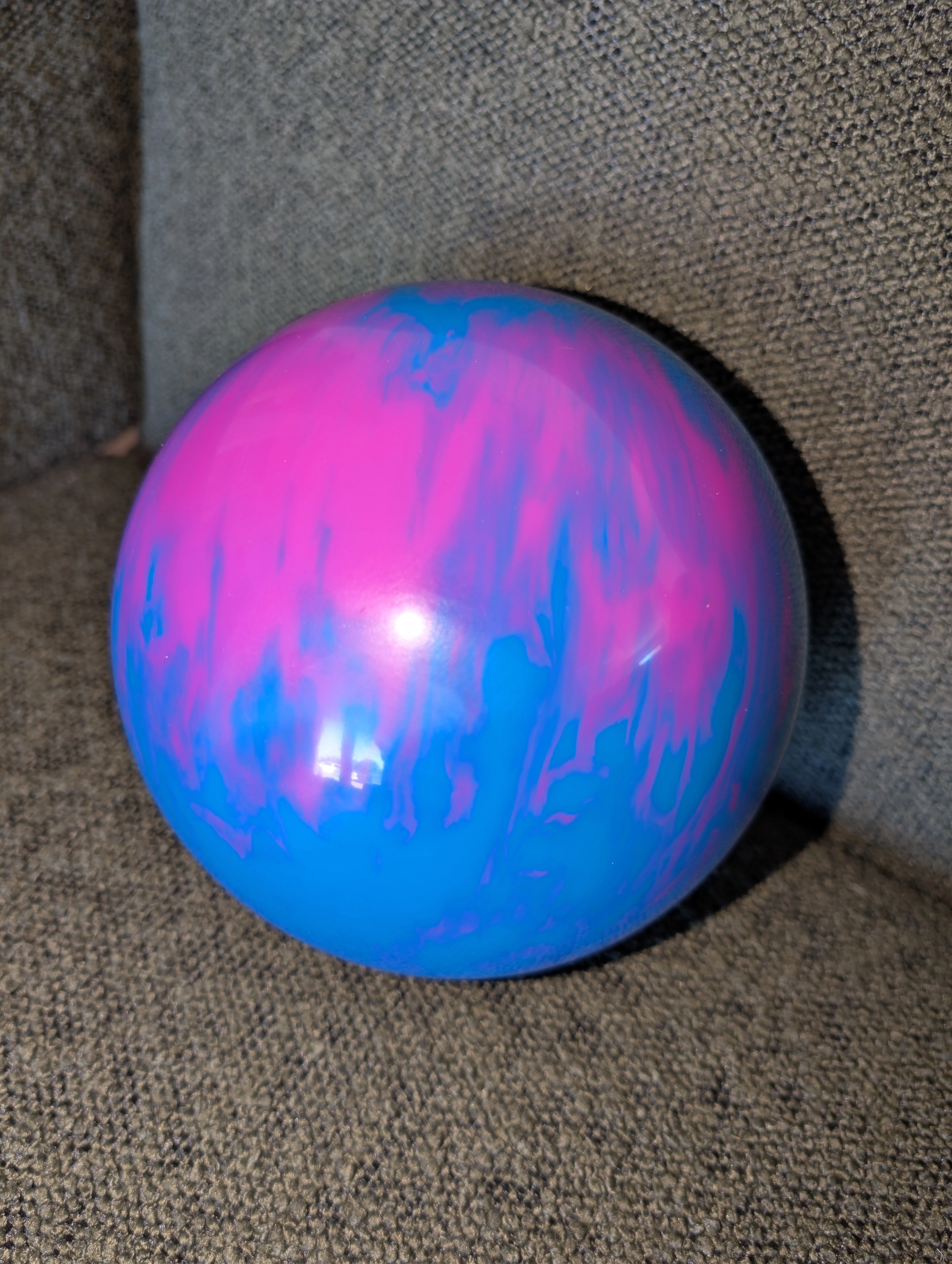Custom pink and blue marbled bowling ball crafted for a LaneCraft installation